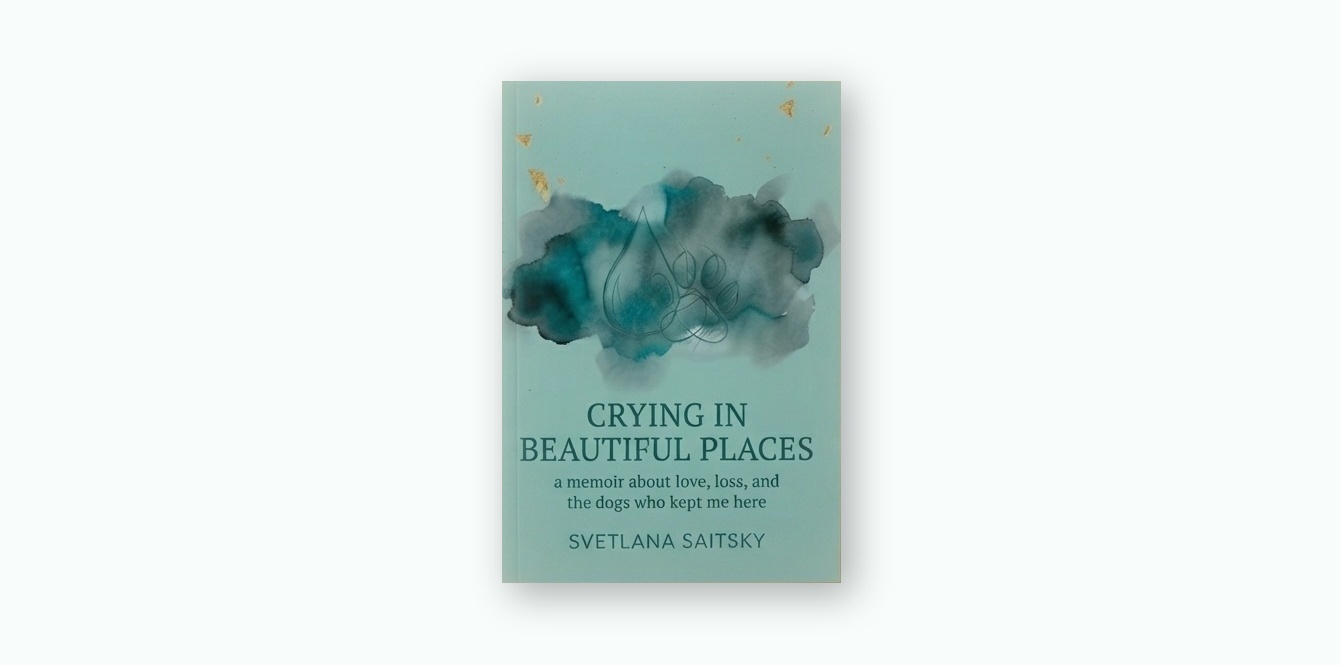 Crying in Beautiful Places book cover: a teal watercolor wash with a gold-flecked ink line drawing of a dog, on a warm gold gradient background